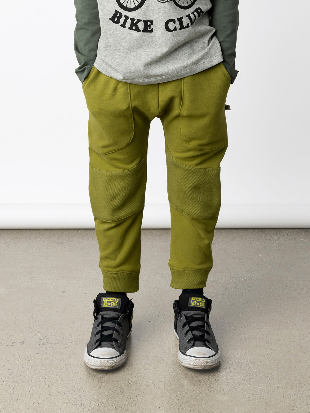 Minti kids clothing. Super cool baggy trackies featuring elastic waistband, front pockets, back pocket, 2x2 rib cuffs and reinforced 2x2 rib knee patches. Minti embroidery on the back pocket. 330 Gram // Brushed Inside // 95% Cotton // 5% Elastane.