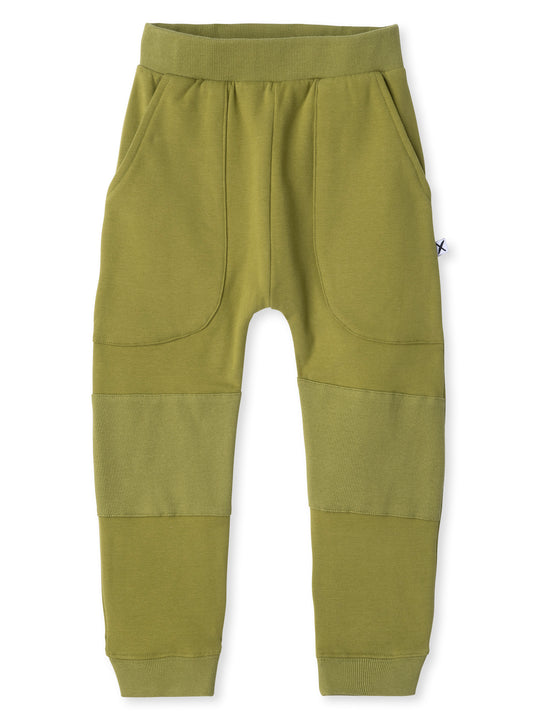 Minti kids clothing. Super cool baggy trackies featuring elastic waistband, front pockets, back pocket, 2x2 rib cuffs and reinforced 2x2 rib knee patches. Minti embroidery on the back pocket. 330 Gram // Brushed Inside // 95% Cotton // 5% Elastane.