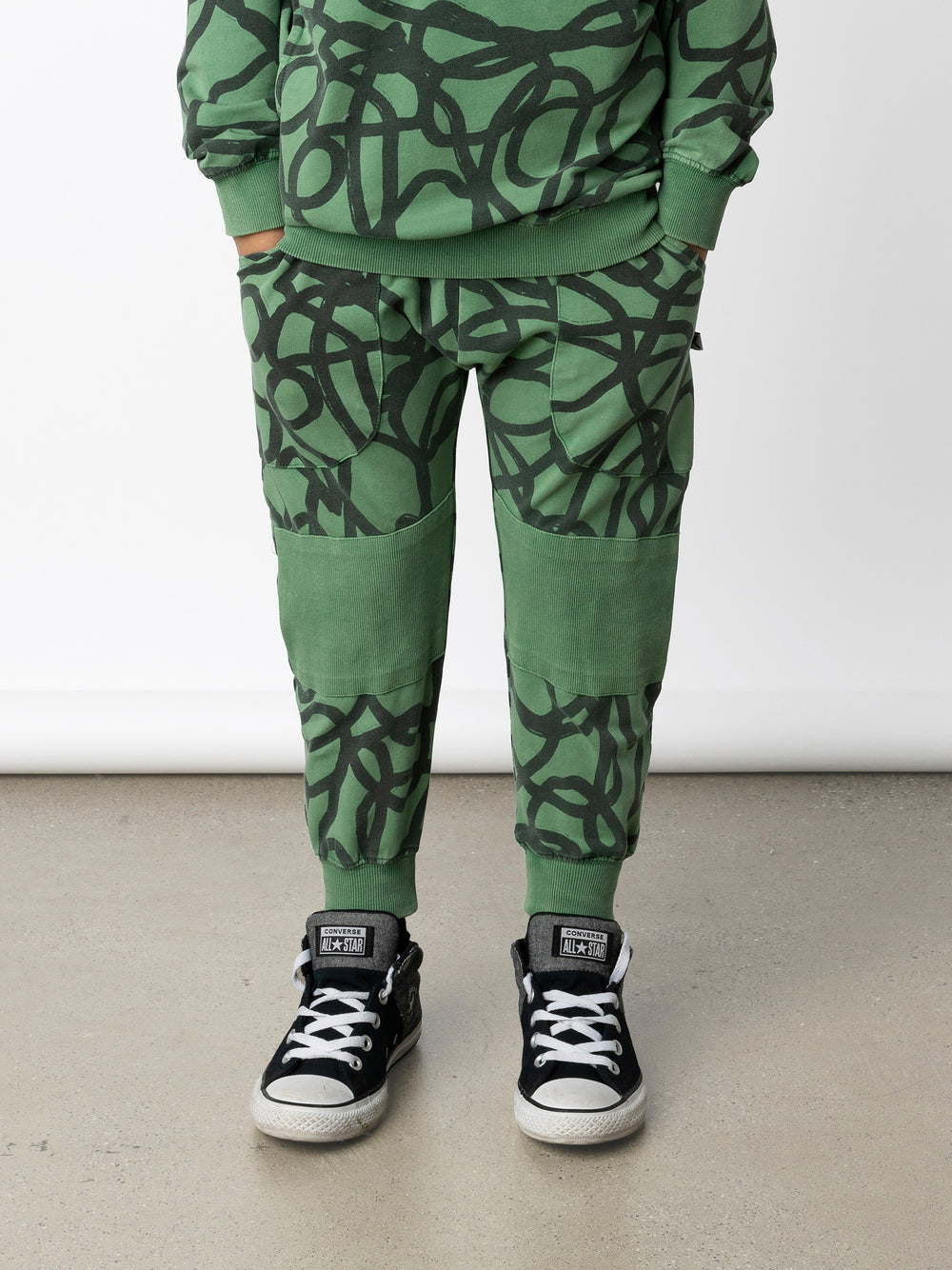 Minti kids clothing. Super cool baggy trackies featuring elastic waistband, front pockets, back pocket, 2x2 rib cuffs and reinforced 2x2 rib knee patches. 260 Gram // 95% Cotton // 5% Elastane.