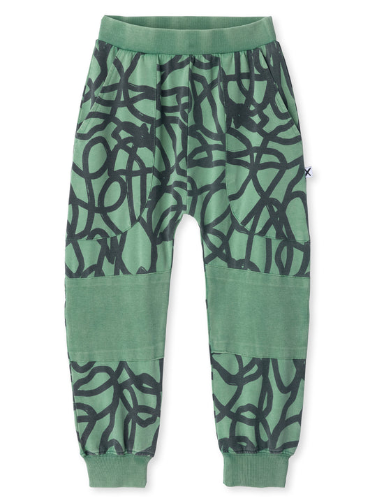 Minti kids clothing. Super cool baggy trackies featuring elastic waistband, front pockets, back pocket, 2x2 rib cuffs and reinforced 2x2 rib knee patches. 260 Gram // 95% Cotton // 5% Elastane.