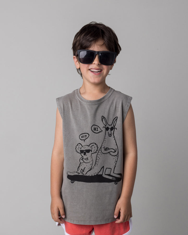 Close up of the Chill Mates Sleeveless Tee in grey wash on a kid, front view