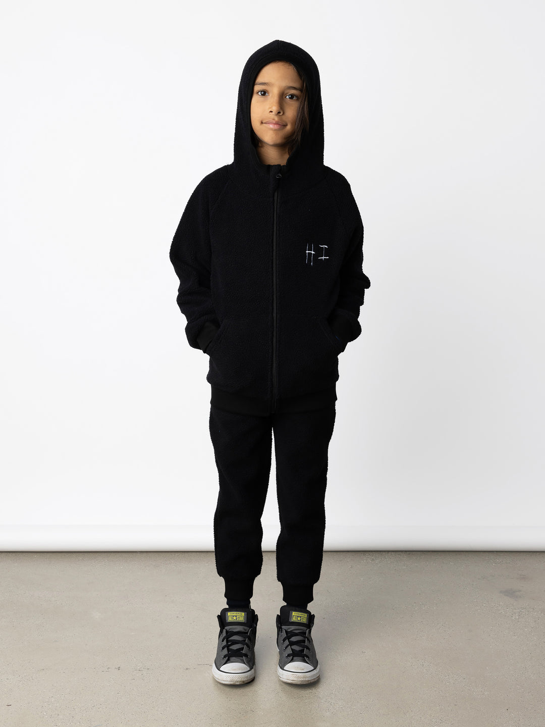 Minti kids clothing. Super cosy and soft Zip Up made in teddy with 2x2 rib cuffs and hem. Front pocket to keep hands warm. 70% Polyester // 30% Cotton.