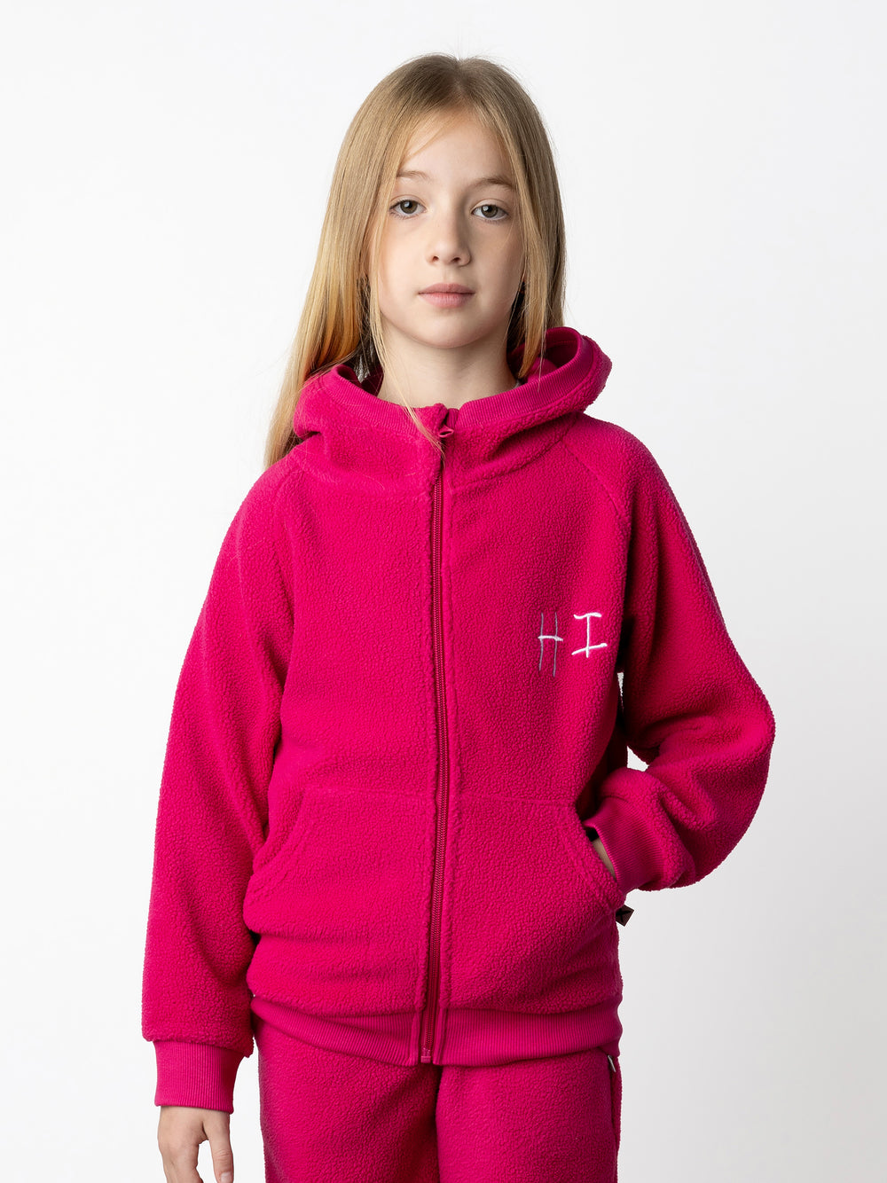 Minti kids clothing. Super cosy and soft Zip Up made in teddy with 2x2 rib cuffs and hem. Front pocket to keep hands warm. 70% Polyester // 30% Cotton.