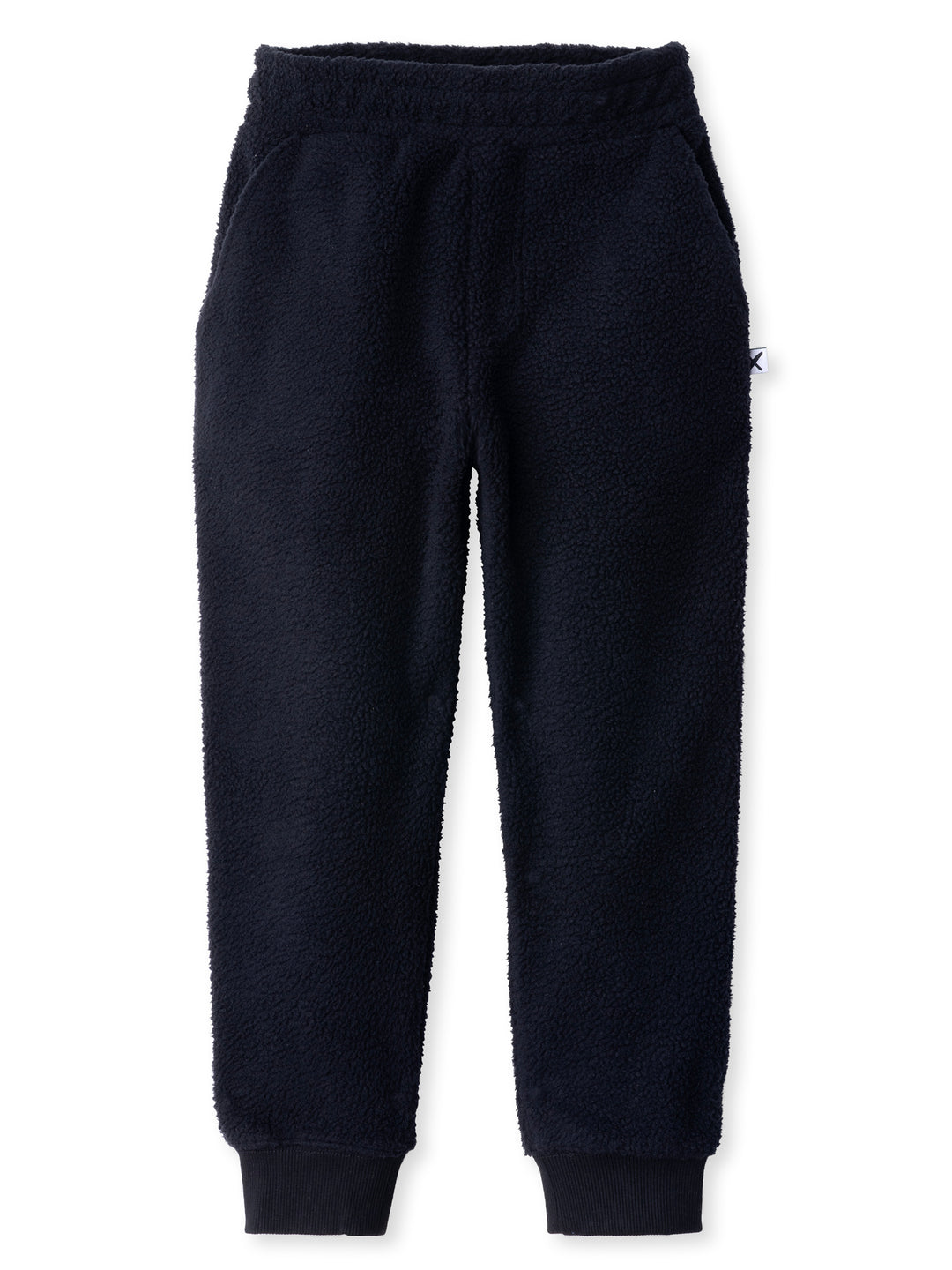 Minti kids clothing. Super cosy and soft loose leg trackies made in teddy with 2x2 rib cuffs. Front pocket to keep hands warm. Small Minti embroidery on the back. 70% Polyester // 30% Cotton.
