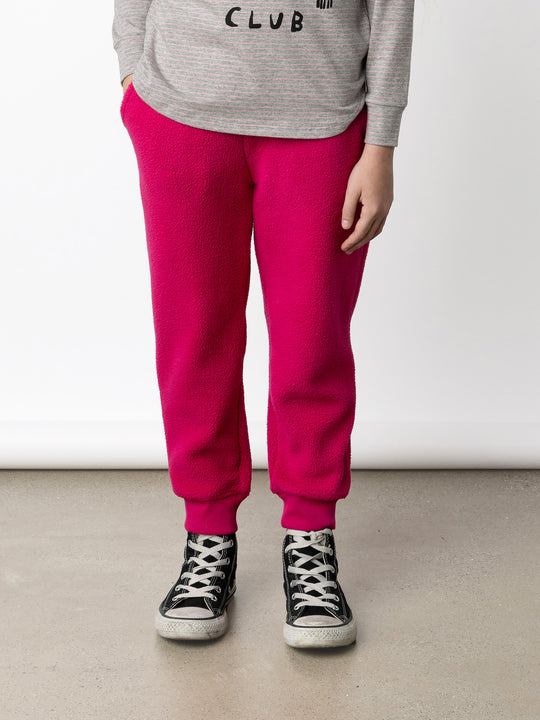 Minti kids clothing. Super cosy and soft loose leg trackies made in teddy with 2x2 rib cuffs. Front pocket to keep hands warm. Small Minti embroidery on the back. 70% Polyester // 30% Cotton.