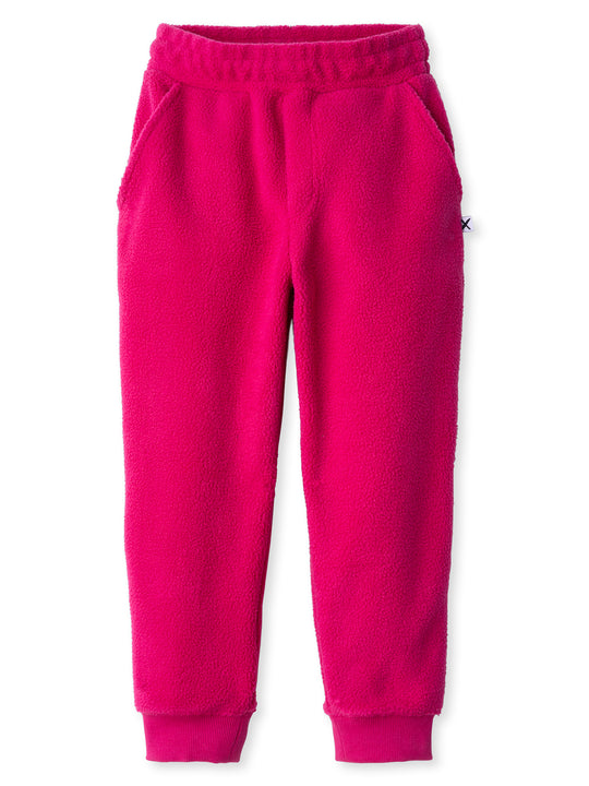 Minti kids clothing. Super cosy and soft loose leg trackies made in teddy with 2x2 rib cuffs. Front pocket to keep hands warm. Small Minti embroidery on the back. 70% Polyester // 30% Cotton.