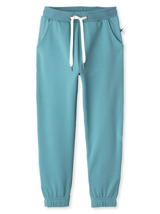 Minti kids clothing. Wider leg trackies with front pockets, shoelace cord, 2x2 rib elasticated waistband and gathered cuffs. Small Minti embroidery on the back. 320 Gram // 95% Cotton // 5% Elastane.