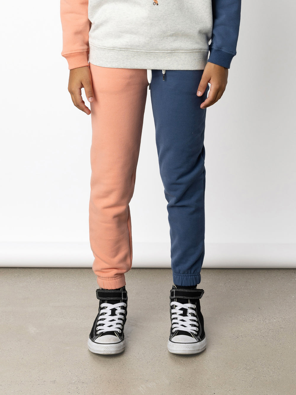 Minti kids clothing. Wider leg trackies with front pockets, shoelace cord, 2x2 rib elasticated waistband and gathered cuffs. Small Minti embroidery on the back. 330 Gram // Brushed Inside // 95% Cotton // 5% Elastane.