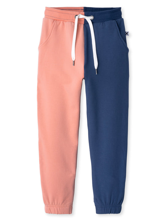Minti kids clothing. Wider leg trackies with front pockets, shoelace cord, 2x2 rib elasticated waistband and gathered cuffs. Small Minti embroidery on the back. 330 Gram // Brushed Inside // 95% Cotton // 5% Elastane.