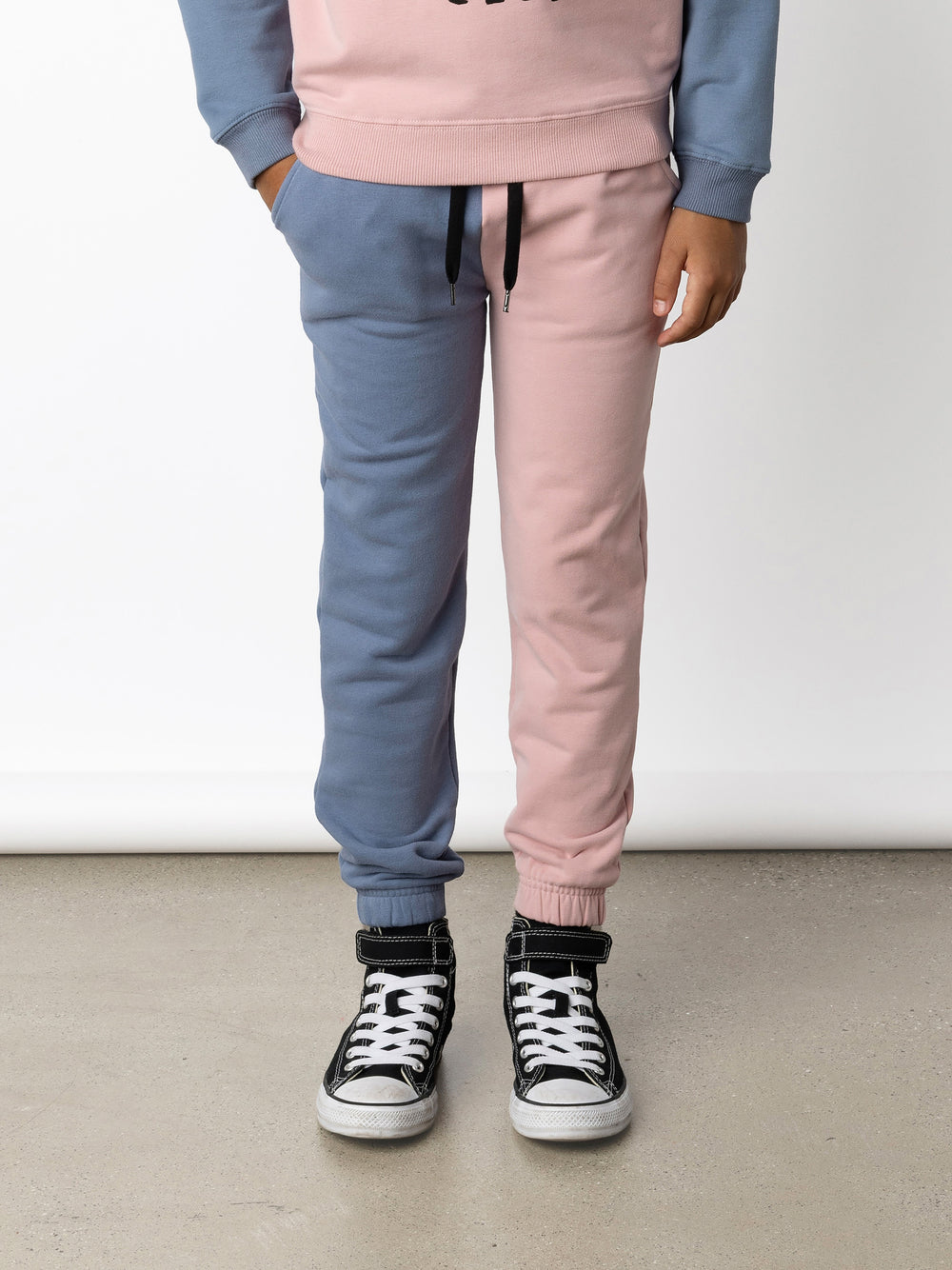 Minti kids clothing. Wider leg trackies with front pockets, shoelace cord, 2x2 rib elasticated waistband and gathered cuffs. Small Minti embroidery on the back. 330 Gram // Brushed Inside // 95% Cotton // 5% Elastane.
