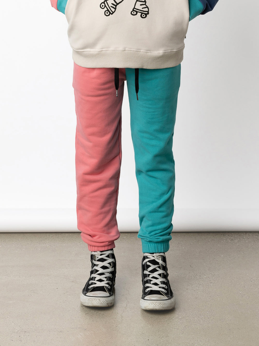 Minti kids clothing. Wider leg trackies with front pockets, shoelace cord, 2x2 rib elasticated waistband and gathered cuffs. Small Minti embroidery on the back. 330 Gram // Brushed Inside // 95% Cotton // 5% Elastane.