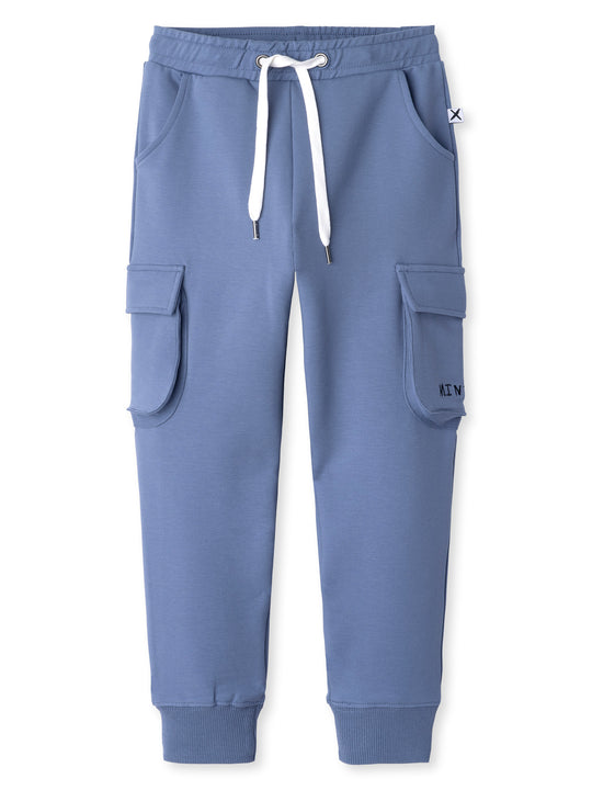 Minti kids clothing. Tapered leg trackies with awesome cargo style pockets, front pockets, shoelace cord and 2x2 rib waistband and cuffs. 320 Gram // 95% Cotton // 5% Elastane.