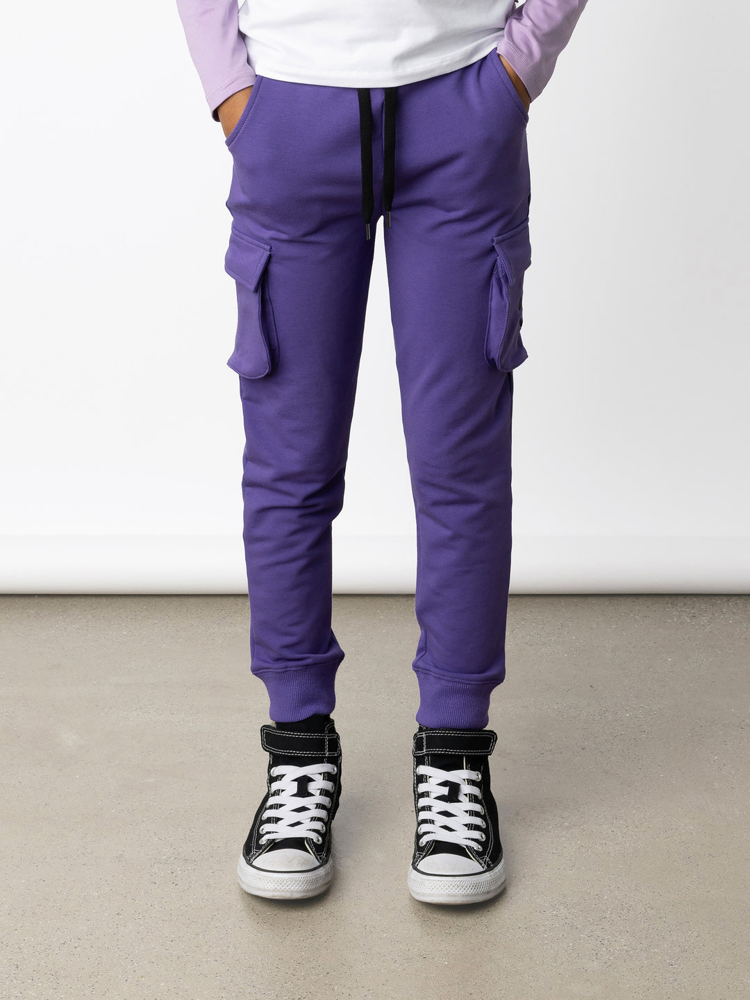 Minti kids clothing. Tapered leg trackies with awesome cargo style pockets, front pockets, shoelace cord and 2x2 rib waistband and cuffs. 320 Gram // 95% Cotton // 5% Elastane.