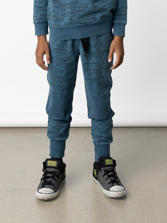Minti kids clothing. Straight leg trackies with reinforced 2x2 rib knee patches, front pockets, elasticated waistband with shoelace cord and a 2x2 rib back pocket. 260 Gram // 95% Cotton // 5% Elastane.