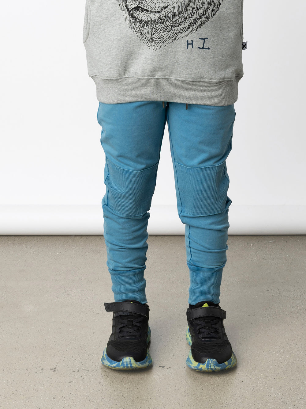 Minti kids clothing. Straight leg trackies with reinforced 2x2 rib knee patches, front pockets, elasticated waistband with shoelace cord and a 2x2 rib back pocket. 260 Gram // 95% Cotton // 5% Elastane.