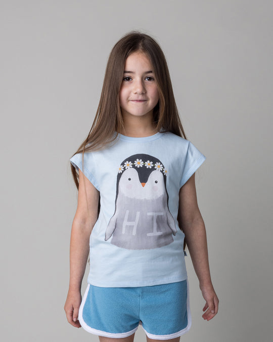 Close up of the Flower Penguin Tee in light blue on a kid, front view