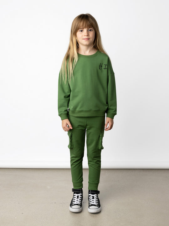 Minti kids clothing. Super cosy oversized universal fit crew with drop shoulder detail. 2x2 Rib at the neck, hem and cuffs. 320 Gram // 95% Cotton // 5% Elastane.