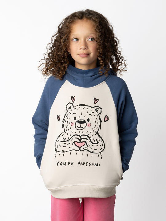 Minti kids clothing. Super soft hoodie with hidden pockets in the side seams. The ribbed-trim hood makes it extra cosy. Soft brushed 'furry' inside. 2x2 Rib at the neck, hem and cuffs. We recommend going up a size for this style. 330 Gram // Brushed Inside // 95% Cotton // 5% Elastane.