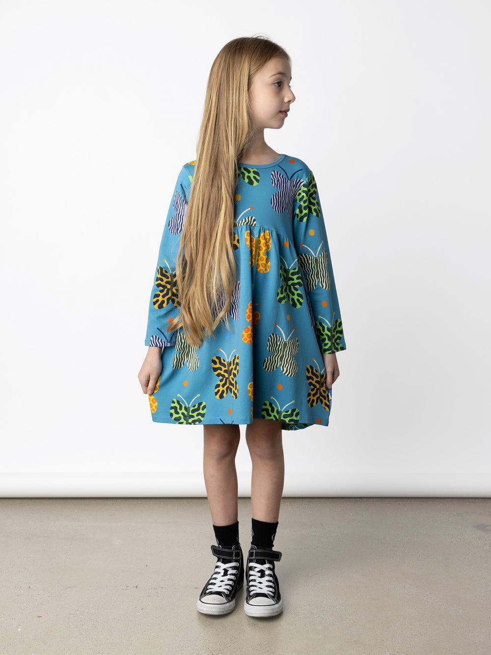 Minti kids clothing. Comfy tshirting weight dress with curved ruched front seam, hidden side pockets and scooped back hem. 190 Gram // 95% Cotton // 5% Elastane.