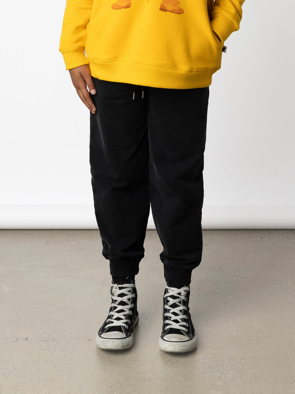 Minti kids clothing. Relaxed universal fit trackies with cosy side pockets, elasticated waistband, shoelace cord and 2x2 Rib cuffs. Small Minti embroidery on the back. 260 Gram // 95% Cotton // 5% Elastane.