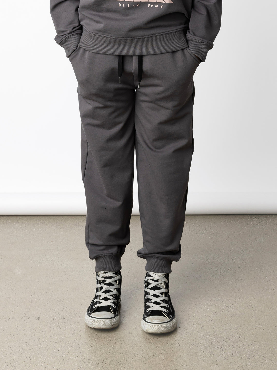 Minti kids clothing. Relaxed universal fit trackies with cosy side pockets, elasticated waistband, shoelace cord and 2x2 Rib cuffs. Small Minti embroidery on the back. 320 Gram // 95% Cotton // 5% Elastane.