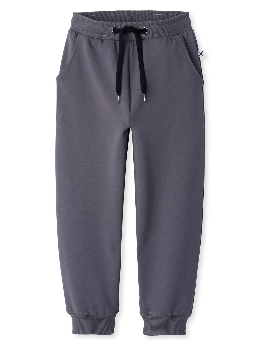 Minti kids clothing. Relaxed universal fit trackies with cosy side pockets, elasticated waistband, shoelace cord and 2x2 Rib cuffs. Small Minti embroidery on the back. 320 Gram // 95% Cotton // 5% Elastane.