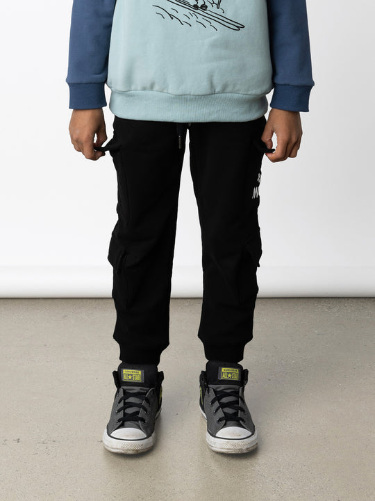 Minti kids clothing. Awesome trackies with slightly wider legs, elastic waistband, front pockets, shoestring cords and 4 super cool cargo pockets for treasures or cold hands. 330 Gram // Brushed Inside // 95% Cotton // 5% Elastane.
