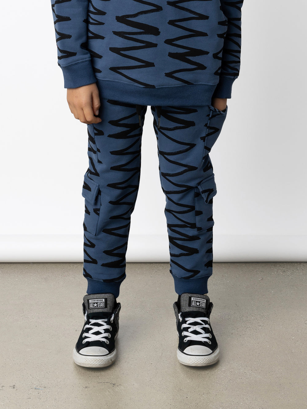 Minti kids clothing. Awesome trackies with slightly wider legs, elastic waistband, front pockets, shoestring cords and 4 super cool cargo pockets for treasures or cold hands. 330 Gram // Brushed Inside // 95% Cotton // 5% Elastane.