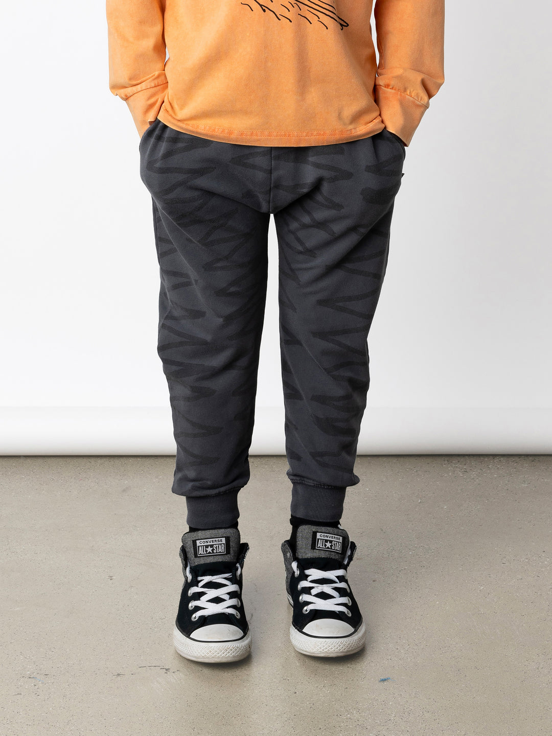 Minti kids clothing. Super cool baggy trackies with elastic waistband, front pockets, back pocket and 2x2 rib cuffs. 260 Gram // 95% Cotton // 5% Elastane.