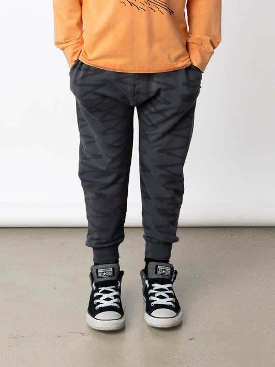 Minti kids clothing. Super cool baggy trackies with elastic waistband, front pockets, back pocket and 2x2 rib cuffs. 260 Gram // 95% Cotton // 5% Elastane.