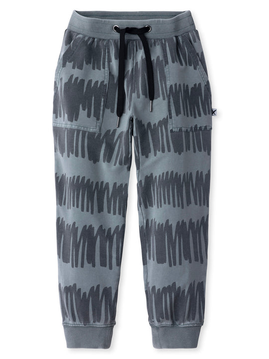 Minti kids clothing. Loose leg trackies with elasticated waistband, shoelace ties, 2x2 rib cuffs and super cool boxy pockets. 260 Gram // 95% Cotton // 5% Elastane.