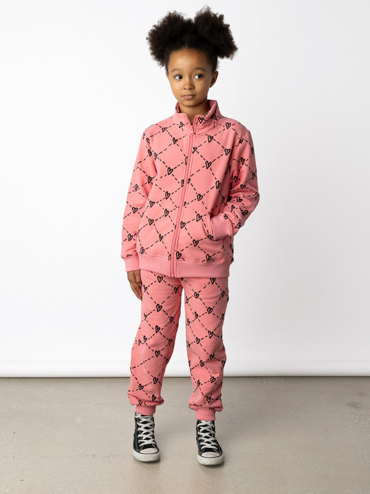 Minti kids clothing. Super cosy and soft zip up high neck crew with 2x2 Rib cuffs and hem. Front kangaroo pocket to keep hands warm. 330 Gram // Brushed Inside // 95% Cotton // 5% Elastane.