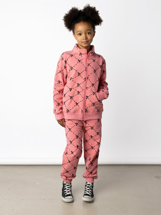 Minti kids clothing. Super cosy and soft zip up high neck crew with 2x2 Rib cuffs and hem. Front kangaroo pocket to keep hands warm. 330 Gram // Brushed Inside // 95% Cotton // 5% Elastane.