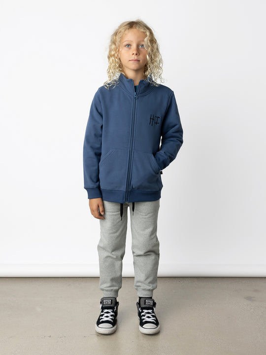 Minti kids clothing. Super cosy and soft zip up high neck crew with 2x2 Rib cuffs and hem. Front kangaroo pocket to keep hands warm. 330 Gram // Brushed Inside // 95% Cotton // 5% Elastane.
