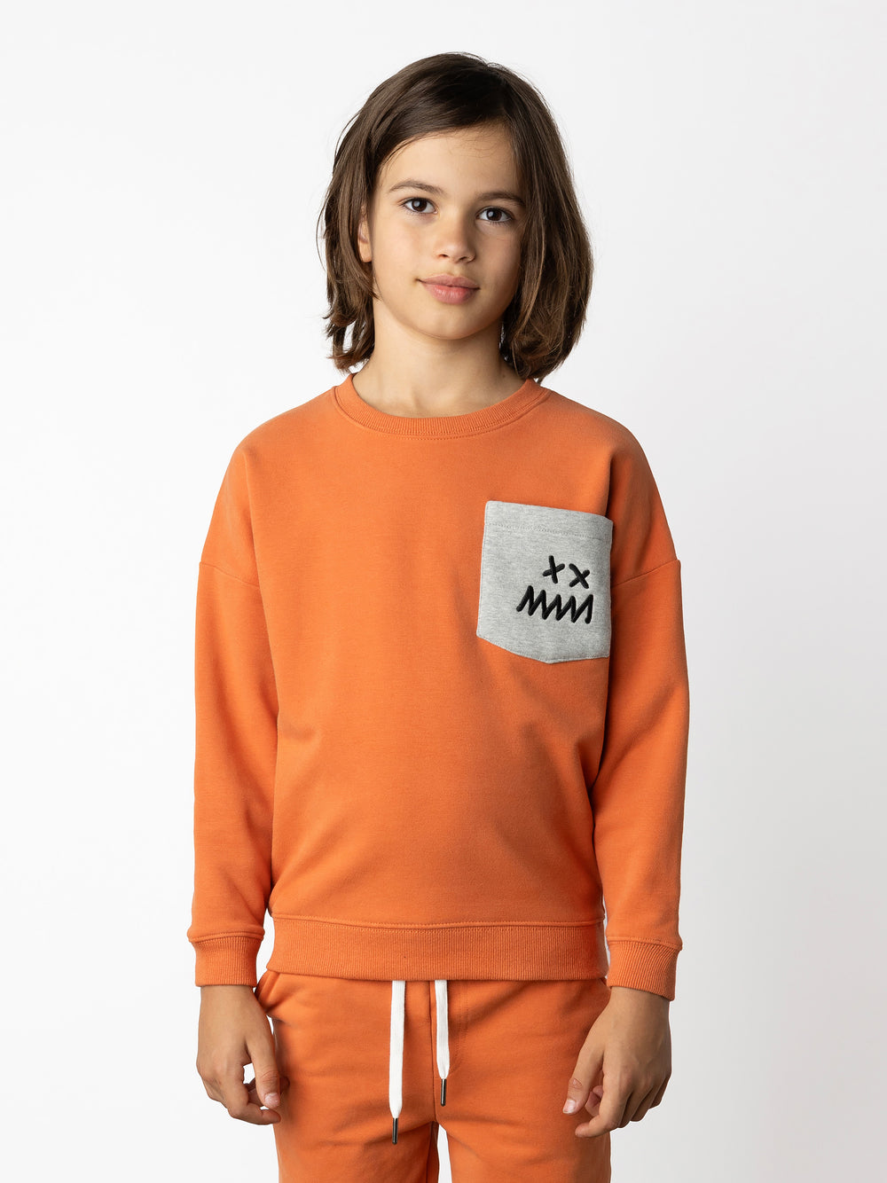 Minti kids clothing. Super cosy oversized fit crew with drop shoulder detail and cool front pocket. 2x2 Rib at the neck, hem and cuffs. 330 Gram // Brushed Inside // 95% Cotton // 5% Elastane.
