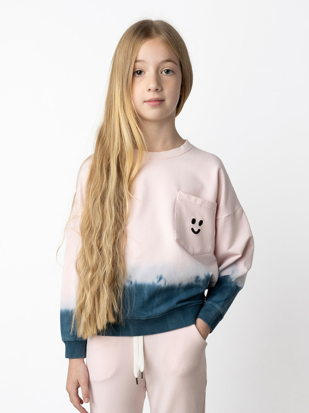 Minti kids clothing. Super cosy oversized fit crew with drop shoulder detail and cool front pocket. 2x2 Rib at the neck, hem and cuffs. 320 Gram // 95% Cotton // 5% Elastane.