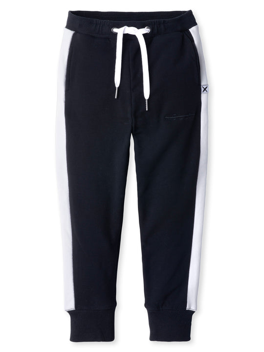 Minti kids clothing. Slim leg trackies with super cool contrast side panel! Front pockets, one back pocket, 2x2 rib elasticated waistband with shoelace tie. 2x2 rib cuffs. Small tonal Minti embroidery on the front. 330 Gram // Brushed Inside // 95% Cotton // 5% Elastane.