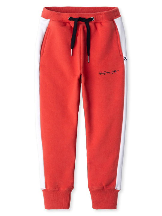 Minti kids clothing. Slim leg trackies with super cool contrast side panel! Front pockets, one back pocket, 2x2 rib elasticated waistband with shoelace tie. 2x2 rib cuffs. Small tonal Minti embroidery on the front. 330 Gram // Brushed Inside // 95% Cotton // 5% Elastane.