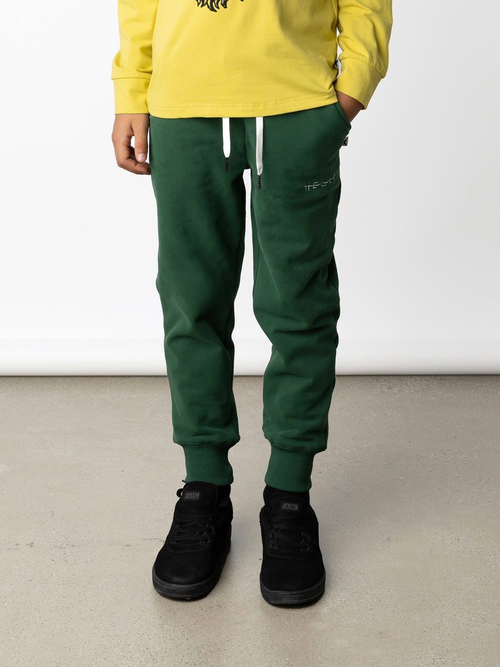 Minti kids clothing. Straight leg trackies with rounded front pockets, elastic waistband, shoelace ties, 2x2 rib cuffs and a small embroidery on the front. 330 Gram // Brushed Inside // 95% Cotton // 5% Elastane.