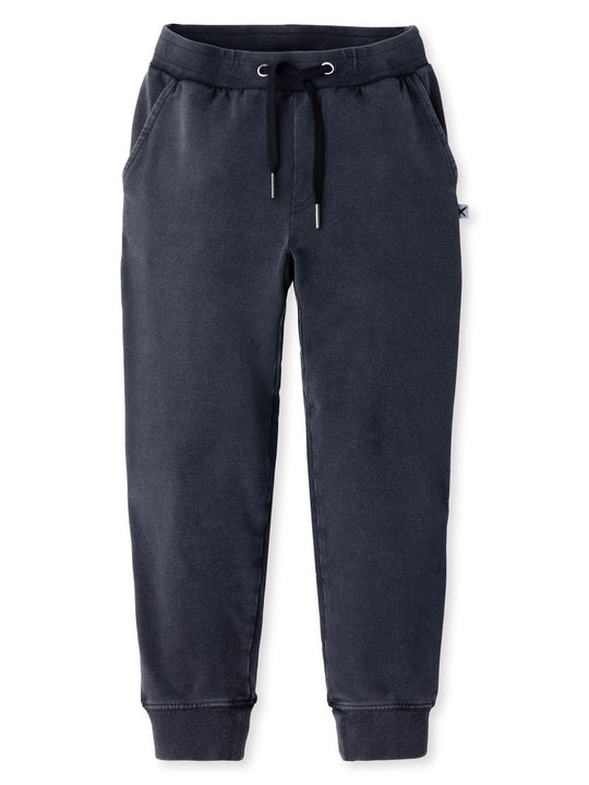 Minti kids clothing. Relaxed leg trackies featuring an elasticated waistband, front pockets, shoestring cord and one back pocket with a Minti embroidery. Gusset panel through the inner leg for extra comfort and easy movement. 260 Gram // 95% Cotton // 5% Elastane.