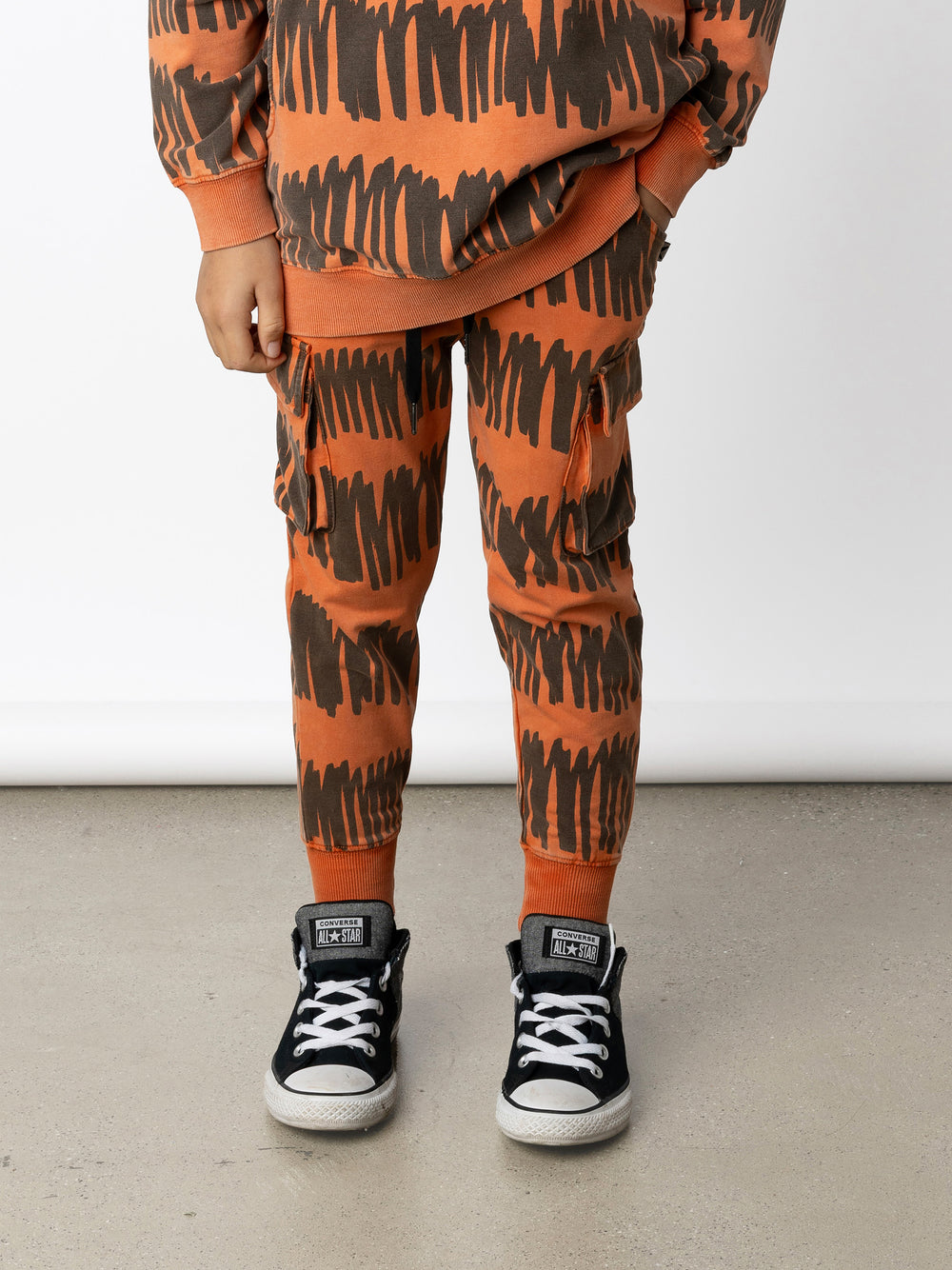 Minti kids clothing. Straight leg trackies with front pockets, elasticated waistband, 2x2 rib on waistband and cuffs and super cool cargo pockets for treasures! 260 Gram // 95% Cotton // 5% Elastane.