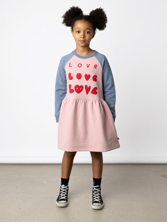 Minti kids clothing. Sweatshirting dress with raglan sleeves, ruched skirt seam and hidden side pockets. 330 Gram // Brushed Inside // 95% Cotton // 5% Elastane.