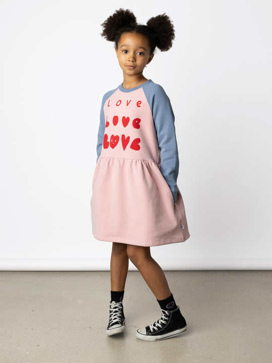 Minti kids clothing. Sweatshirting dress with raglan sleeves, ruched skirt seam and hidden side pockets. 330 Gram // Brushed Inside // 95% Cotton // 5% Elastane.