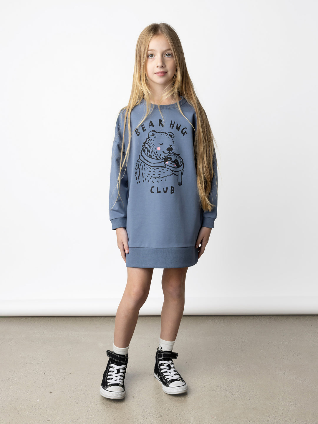 Minti kids clothing. Super cosy sweatshirting weight dress with drop shoulder detail. 2x2 Rib at the neck, hem and cuffs. Hidden side pockets. 320 Gram // 95% Cotton // 5% Elastane.