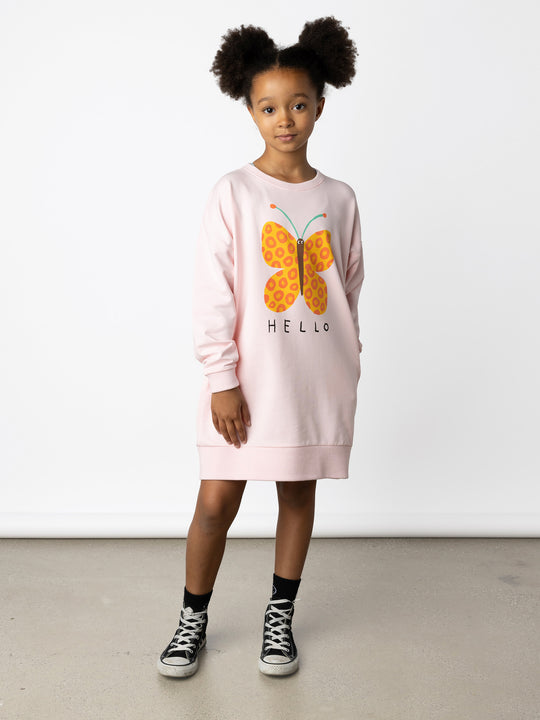 Minti kids clothing. Super cosy sweatshirting weight dress with drop shoulder detail. 2x2 Rib at the neck, hem and cuffs. Hidden side pockets. Print on the front and the back. 320 Gram // 95% Cotton // 5% Elastane.
