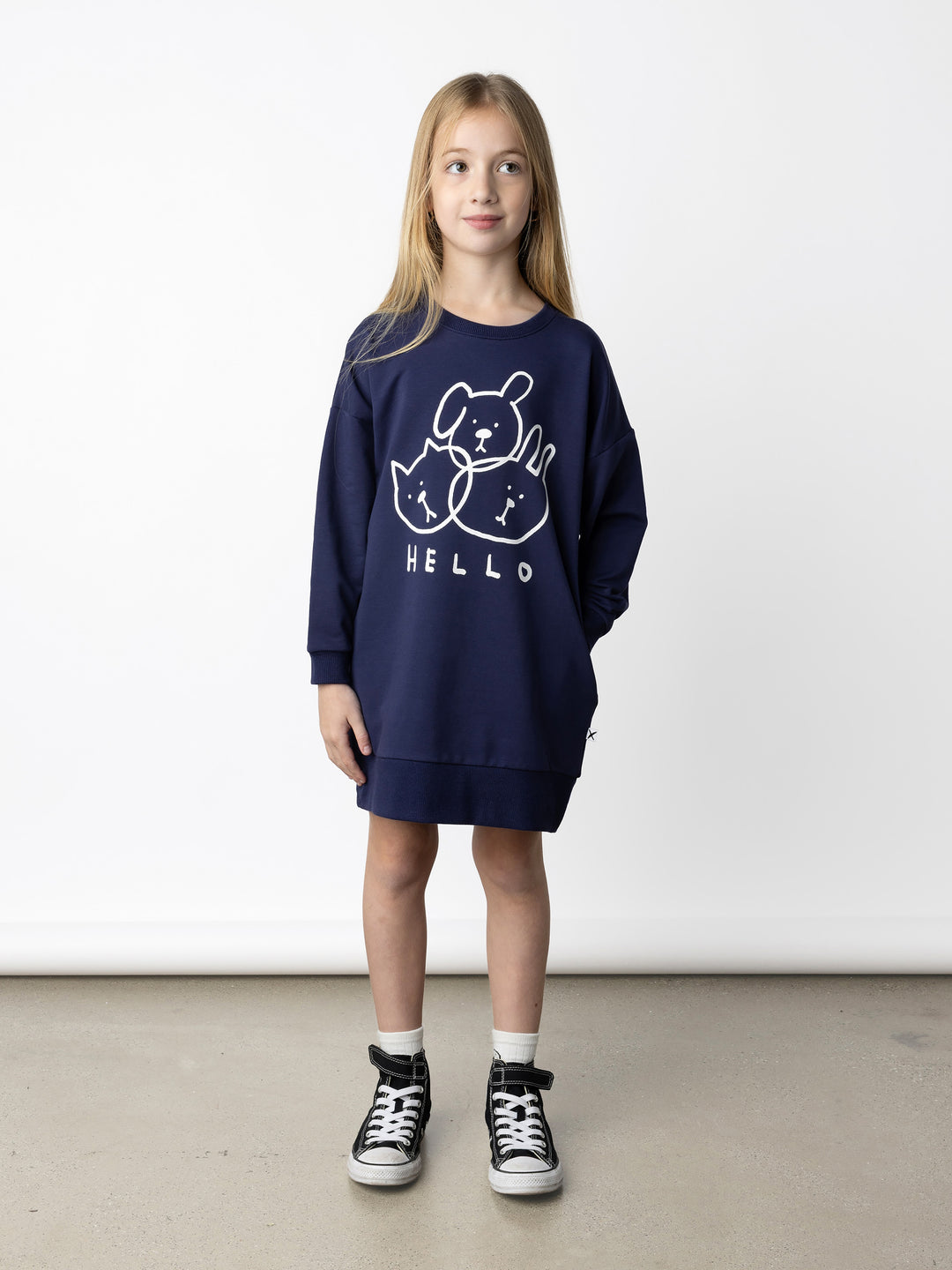 Minti kids clothing. Super cosy sweatshirting weight dress with drop shoulder detail. 2x2 Rib at the neck, hem and cuffs. Hidden side pockets. 320 Gram // 95% Cotton // 5% Elastane.