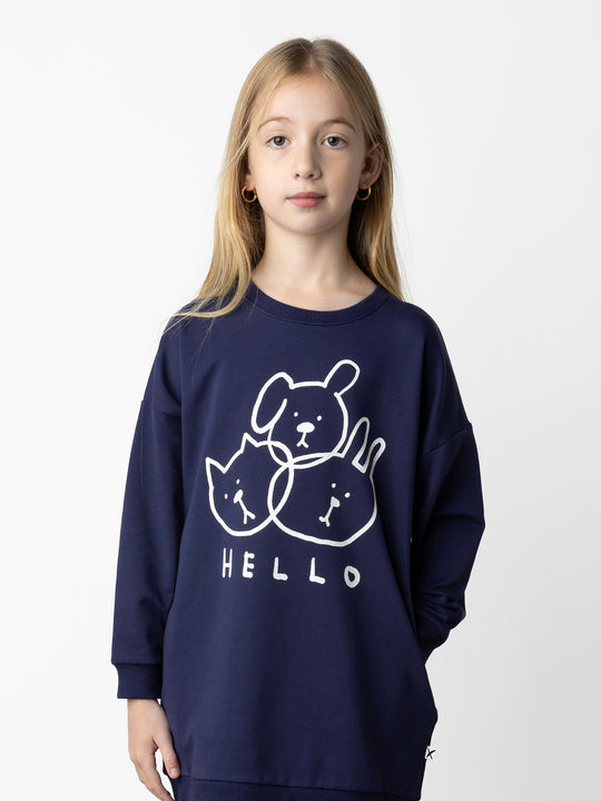 Minti kids clothing. Super cosy sweatshirting weight dress with drop shoulder detail. 2x2 Rib at the neck, hem and cuffs. Hidden side pockets. 320 Gram // 95% Cotton // 5% Elastane.