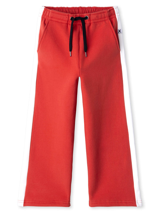 Minti kids clothing. Super relaxed fit wide leg trackies with cool contrast side panel. Elasticated waistband with shoelace cord, and front pockets to keep hands warm. Small Minti embroidery on the back. 330 Gram // Brushed Inside // 95% Cotton // 5% Elastane.