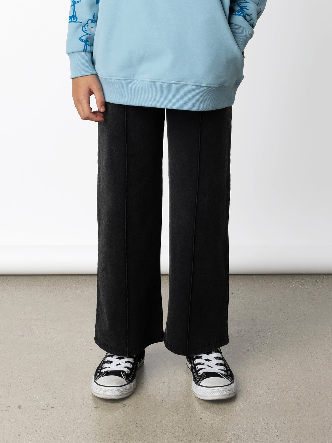 Minti kids clothing. Super relaxed fit wide leg trackies with cool middle seam down the front. Elasticated waistband with shoelace cord, and front pockets to keep hands warm. Small Minti embroidery on the back. 260 Gram // 95% Cotton // 5% Elastane.