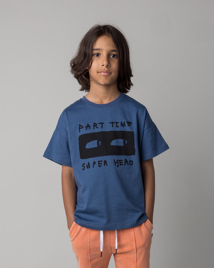 Close up of the Part Time Super Hero Tee in midnight on a kid, front view